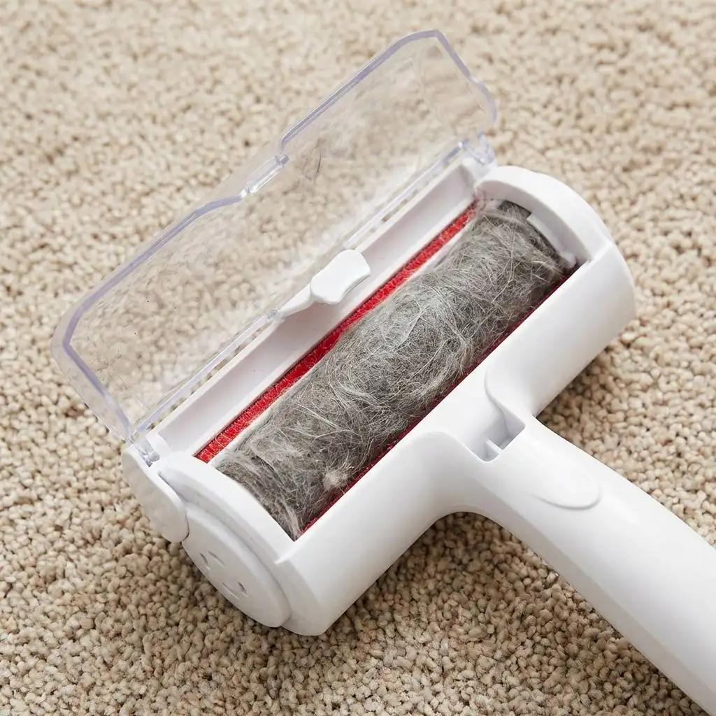 Compressed cylinder of grey dog hair and dust inside the open waste compartment of a cleaning tool on a beige carpet. Compressed cylinder of grey dog hair and dust inside the open waste compartment of a cleaning tool on a beige carpet.